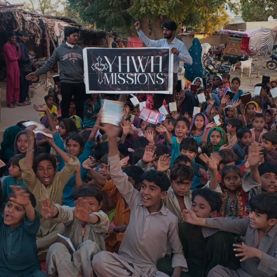 YHWH Missions team distributing food to families in Pakistan